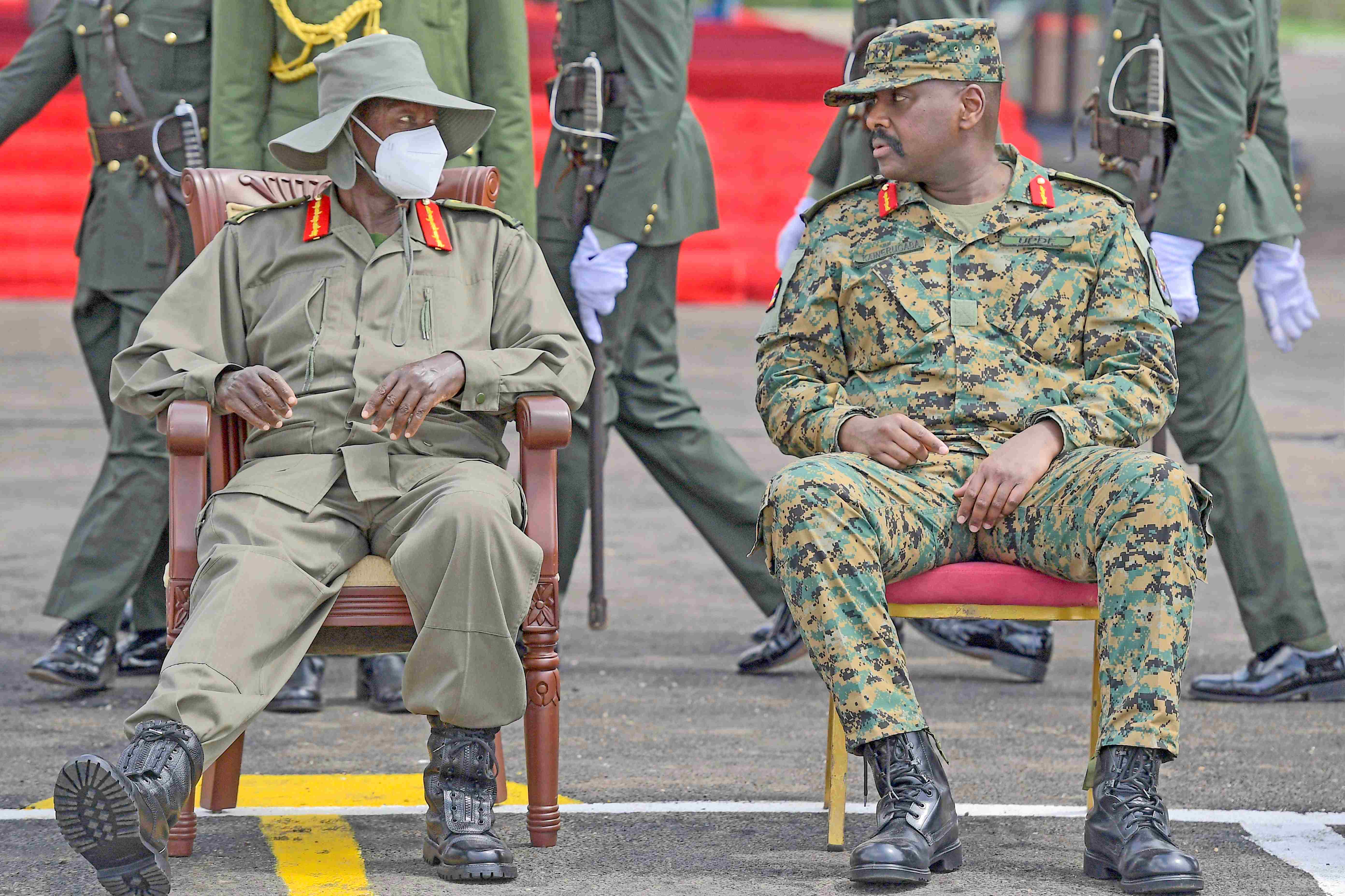 President Yoweri Museveni interacting with CDF, Gen Muhoozi Kainerugaba during commissioning of 352 officer cadets of intake 04/22-25 and professional Cadet short course intake 08/25 at the Uganda Military Academy Kabamba, Mubende District on October 4, 2025.