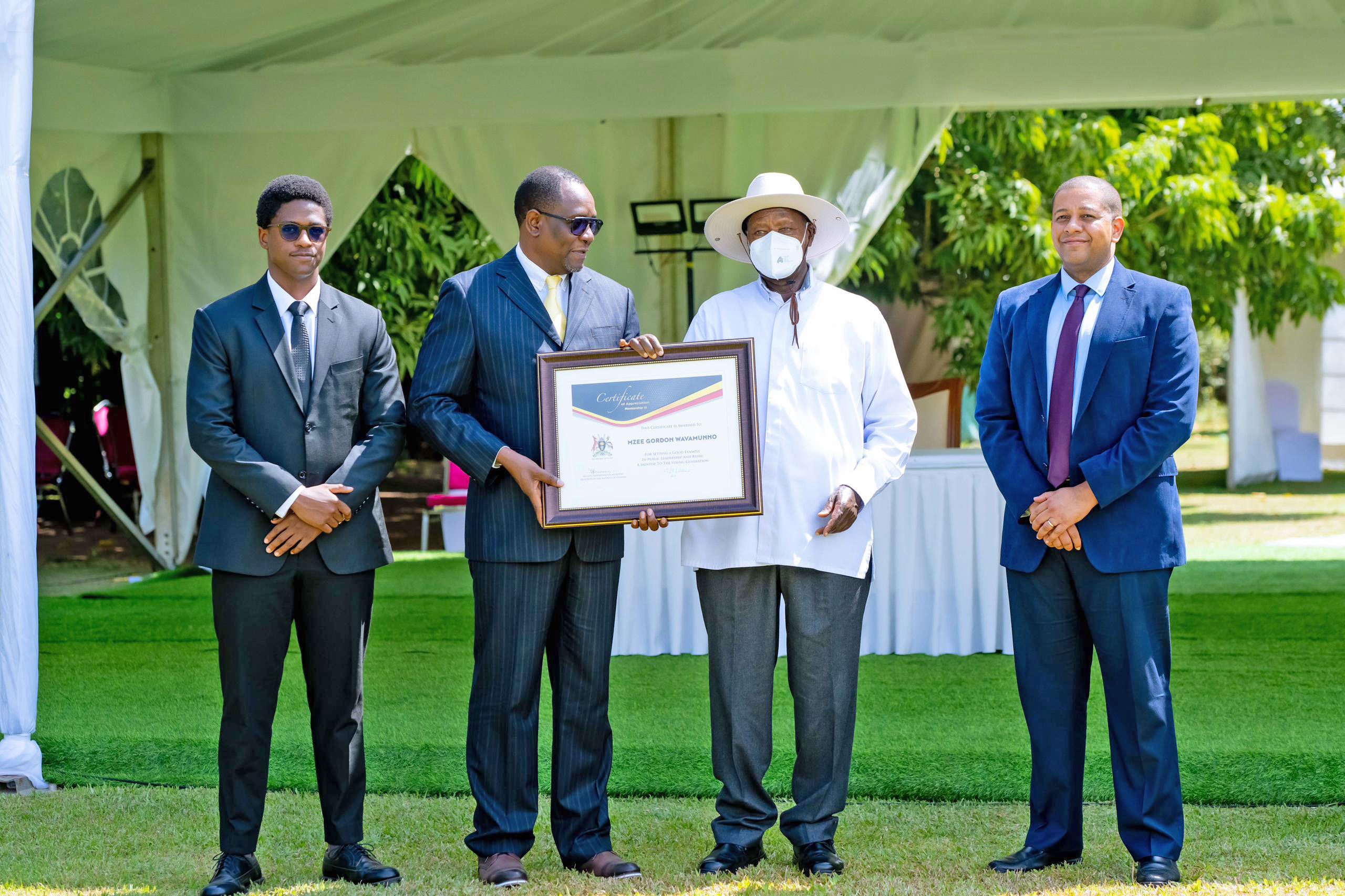 President Yoweri Museveni awarding Justice James Ogola (2nd left) during the National Mentorship Day Awards ceremony at State House. 18.09.2025