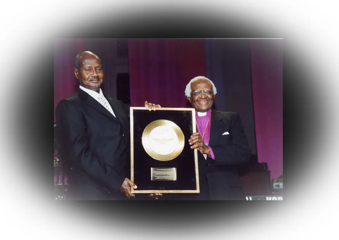 Museveni - A golden plate award to president Yoweri Museveni by retired Bishop D Tutu of South Africa 12.06.2004 2.jpg